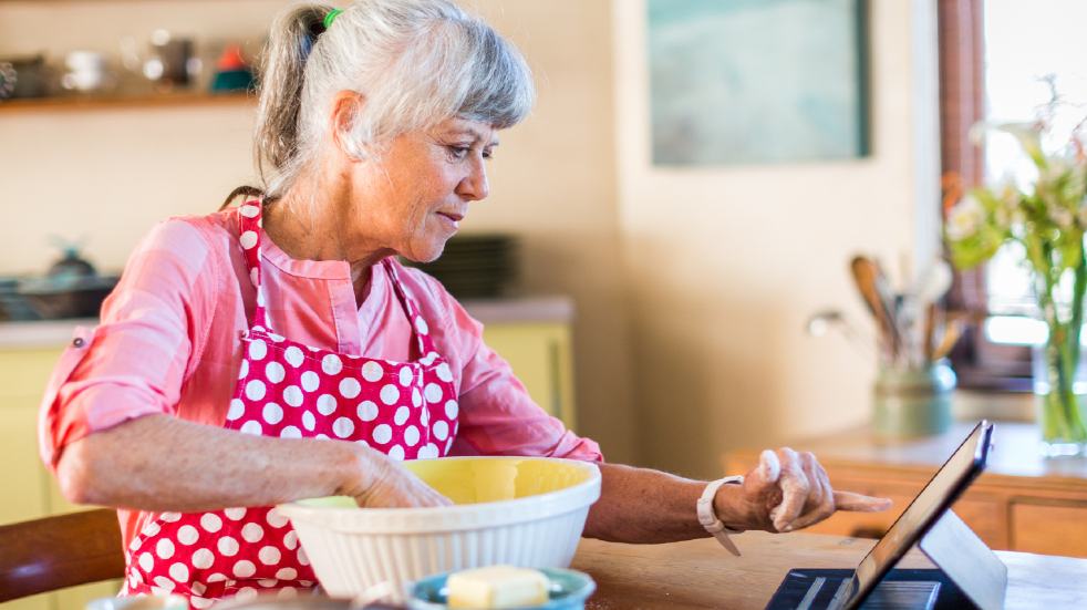 Connect with loved ones during the lockdown woman cooking on tablet